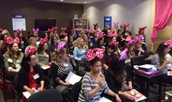 A group of ladies enjoying a Lipstick Luncheon presentation.