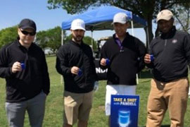 A group of golfers taking a shot with Pandell