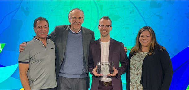 Pandell President Greg Chudiak (far left) with Esri President Jack Dangermond (left).